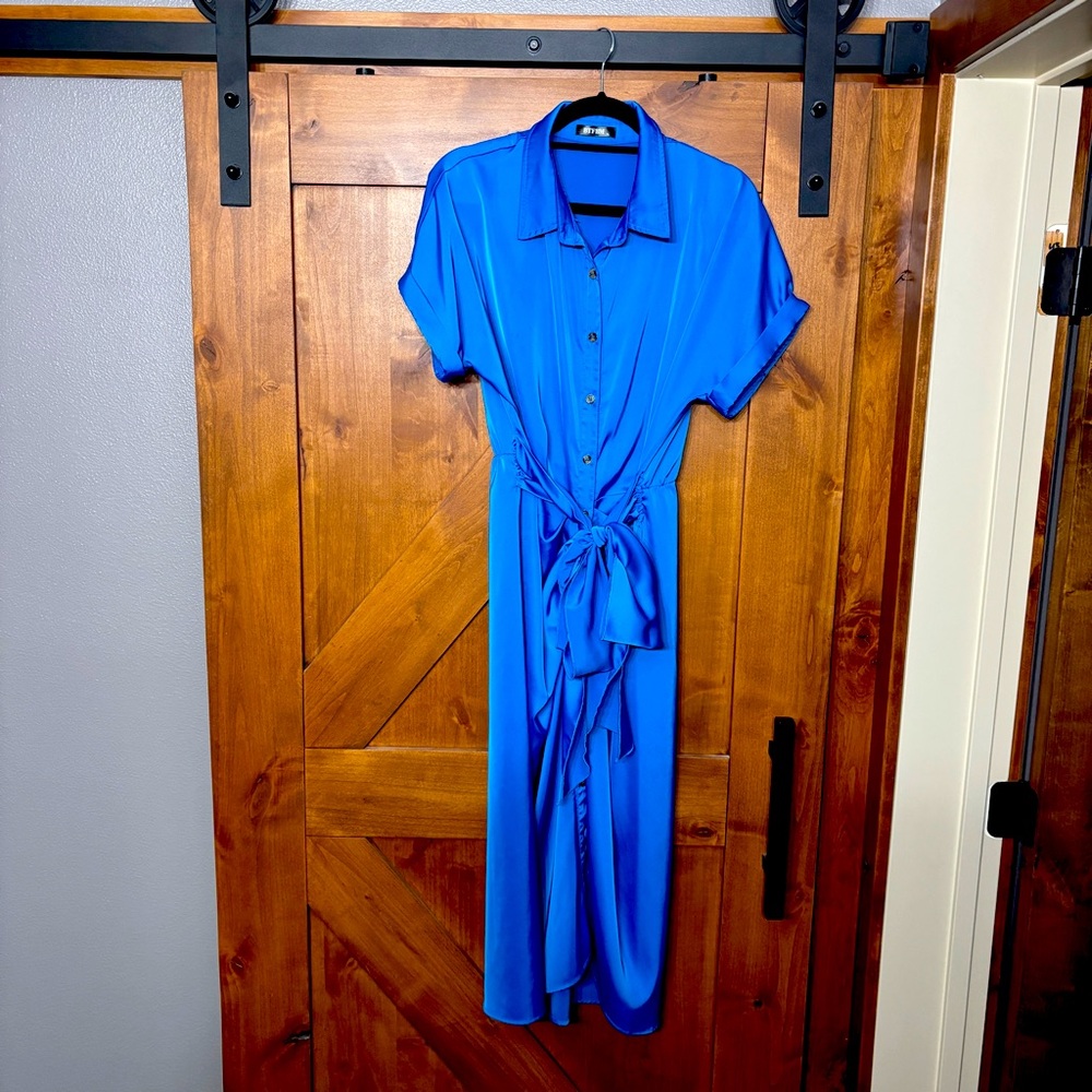 Rich blue dress with tie at waist.